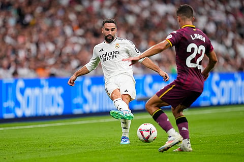 La liga 2024-25: Real Madrid's Dani Carvajal, left, and Valladolid's Lucas Rosa challenge for the ball